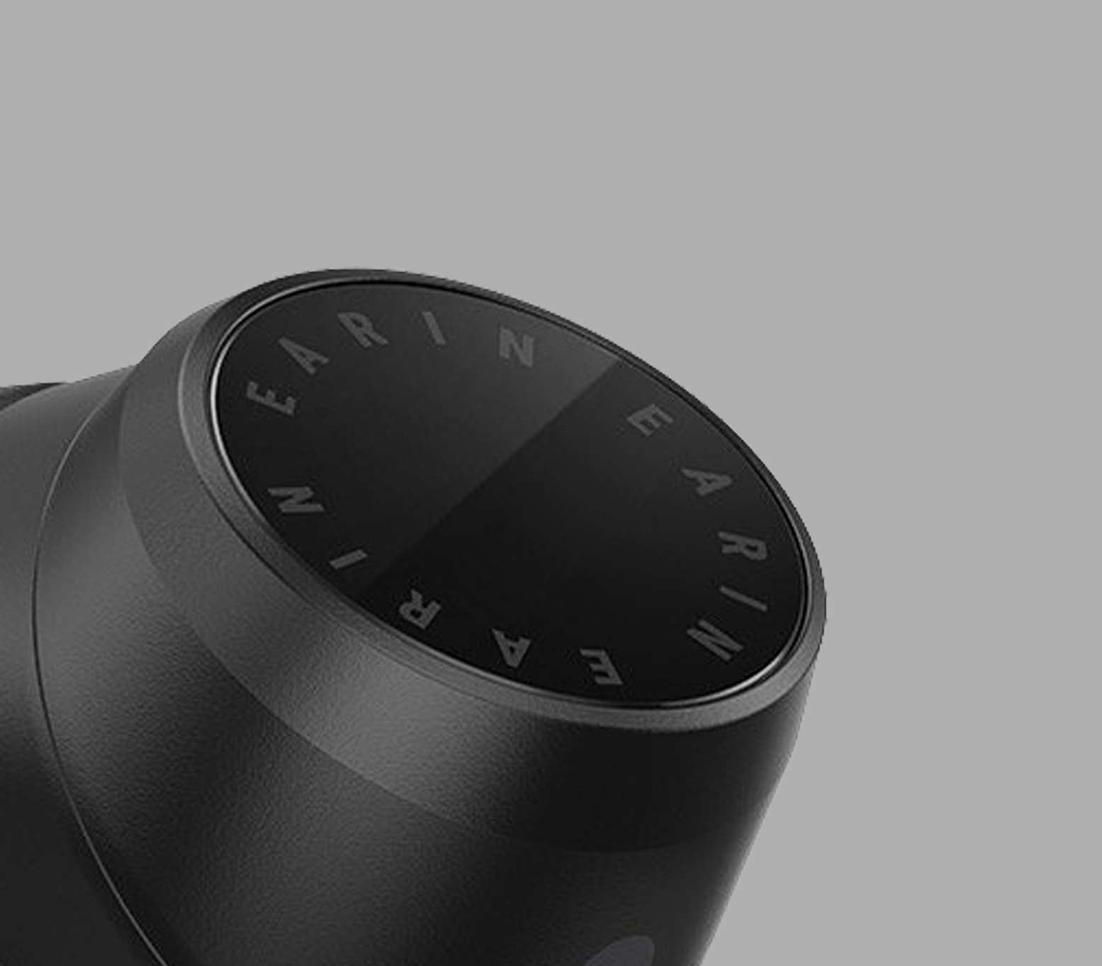 A closeup of a black modern ear bud from the brand Earin 