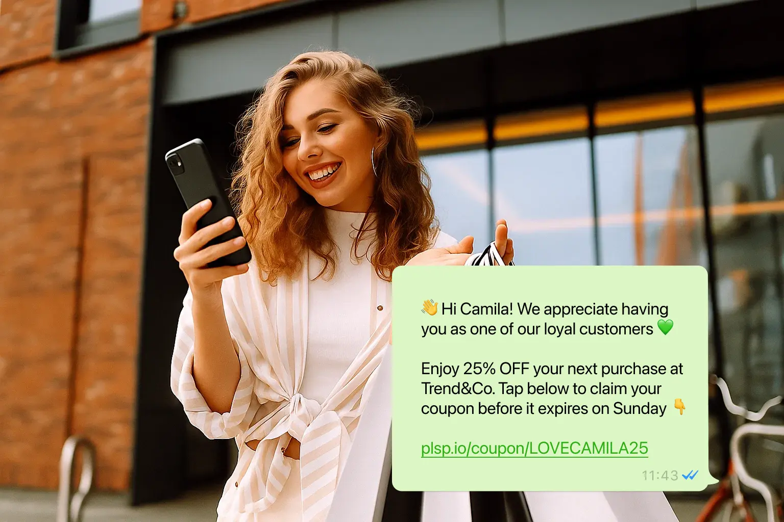 Smiling woman standing outdoors holding a smartphone and reading a WhatsApp message from Trend&Co offering 25% off.
