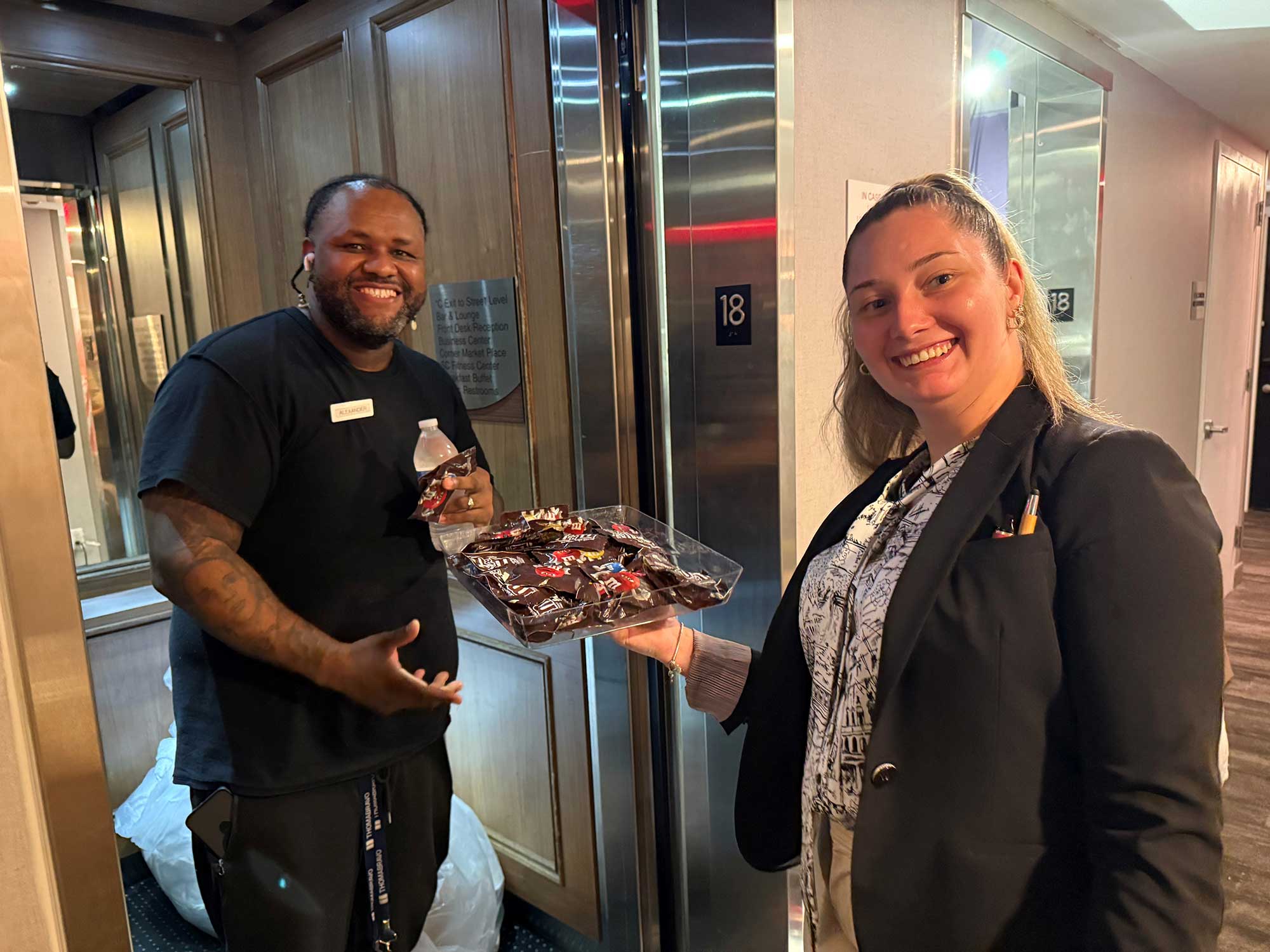 Alexander Vargas, house attendant, and Andrea Tsimbler, manager from the hotel’s housekeeping agency, take an elevator to deliver cold water and treats to associates at the Fairfield New York Manhattan/Central Park.