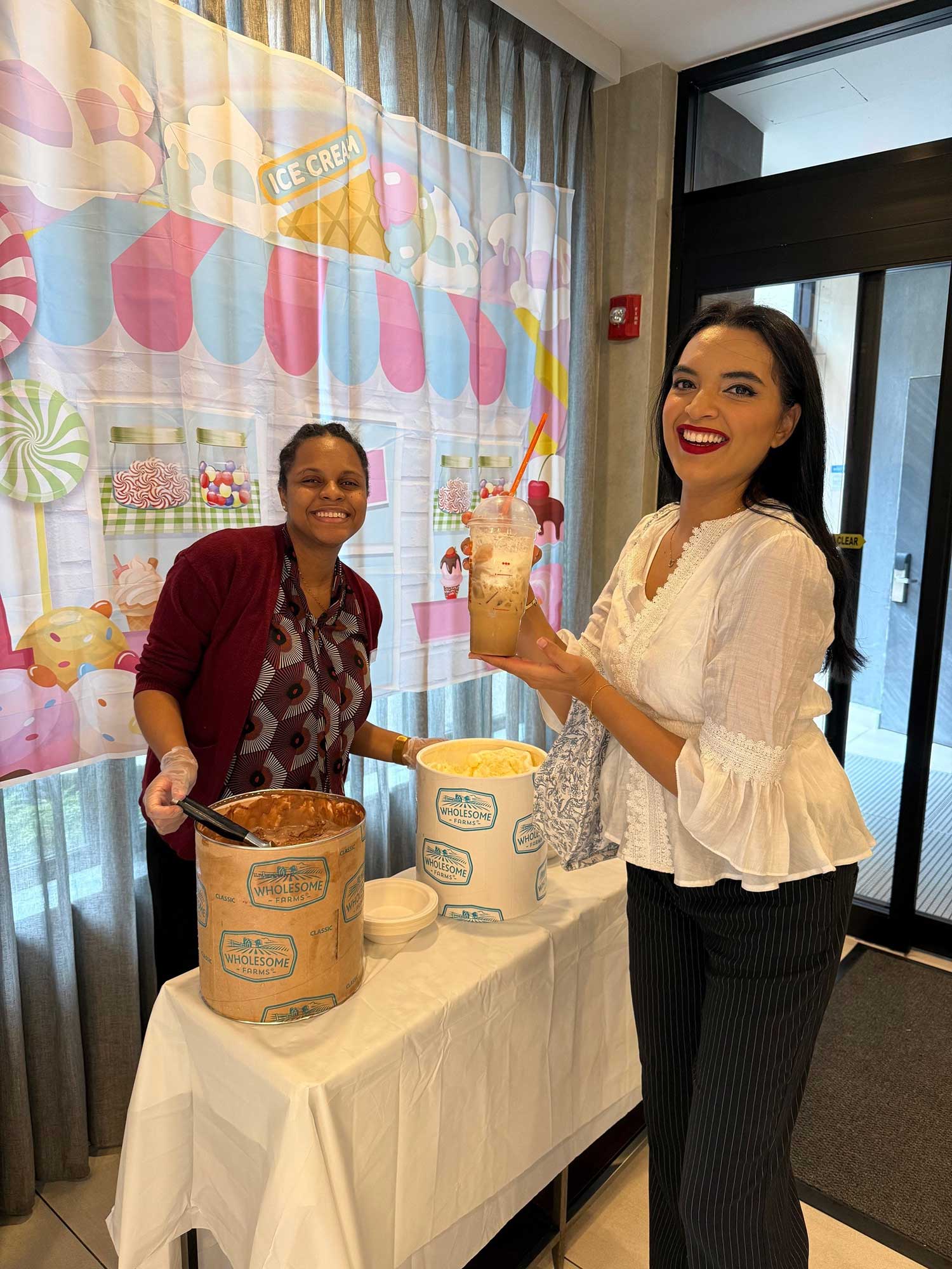 Janeel Brown, room division manager, and Zara Daghastani, guest service agent, are all smiles at the Fairfield New York Manhattan/Central Park ice cream social.