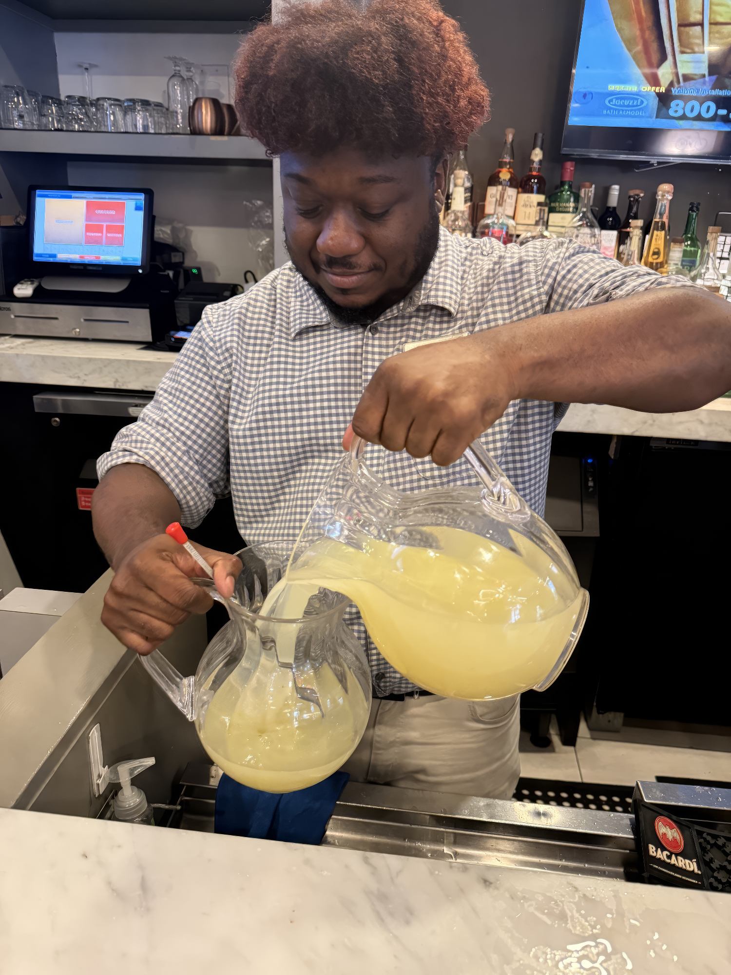 Johnnie Bovain, front office supervisor at the Fairfield New York Manhattan/Central Park, mixes up ice cold lemonade for guests during the hot summer months.