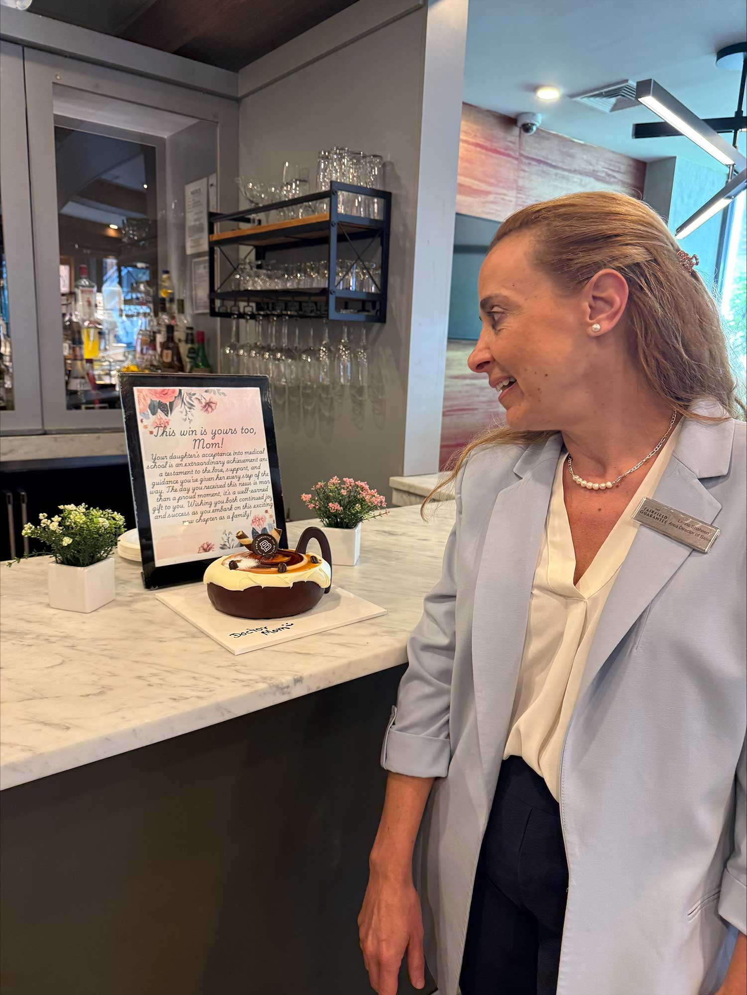 Lenna Shaheen, area director of sales & marketing, is celebrated by the Fairfield New York Manhattan/Central Park team after learning that her daughter was accepted to medical school.