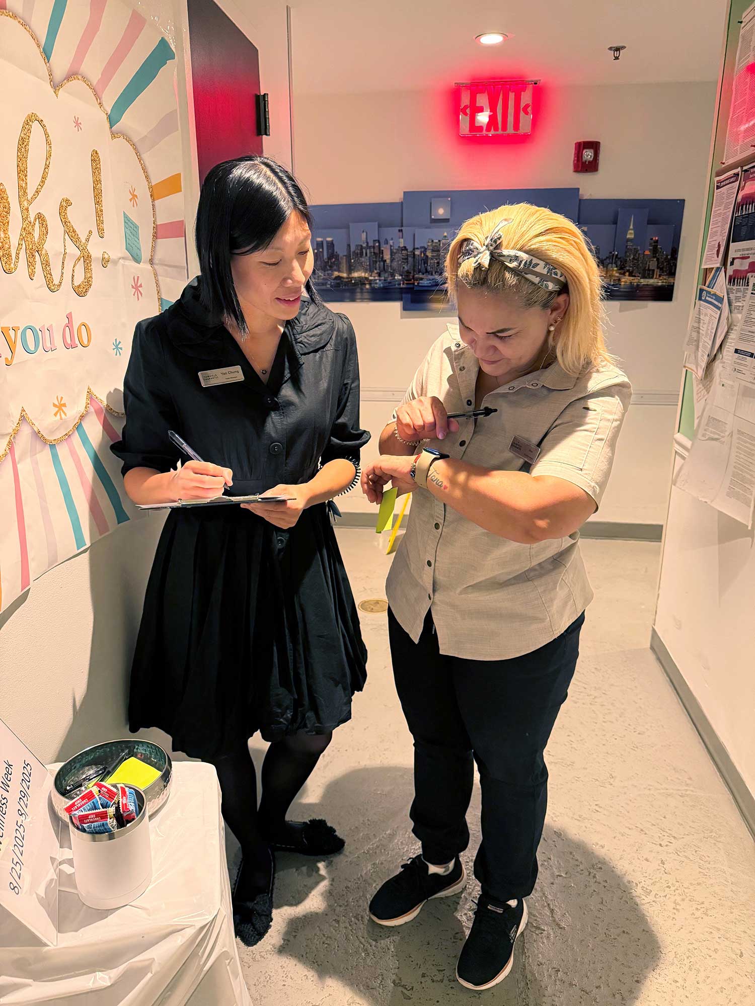 Rosa Mejia, right, breakfast attendant at the Fairfield New York Manhattan/Central Park, participates in the Step Challenge during M&R’s first ever ‘Wellness Week,’ while General Manager Yan Chung tracks her step count.