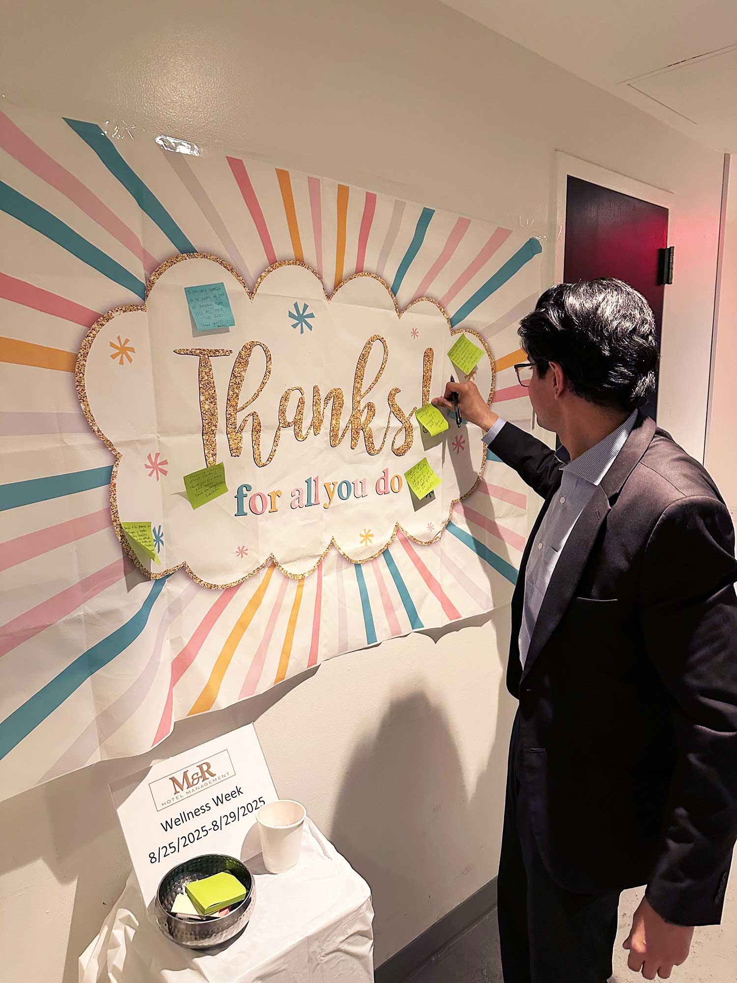 Adnan Javed posts a message of appreciation for his colleagues on a ‘Thank You’ wall, as part of ‘Wellness Week’ at the Fairfield New York Manhattan/Central.