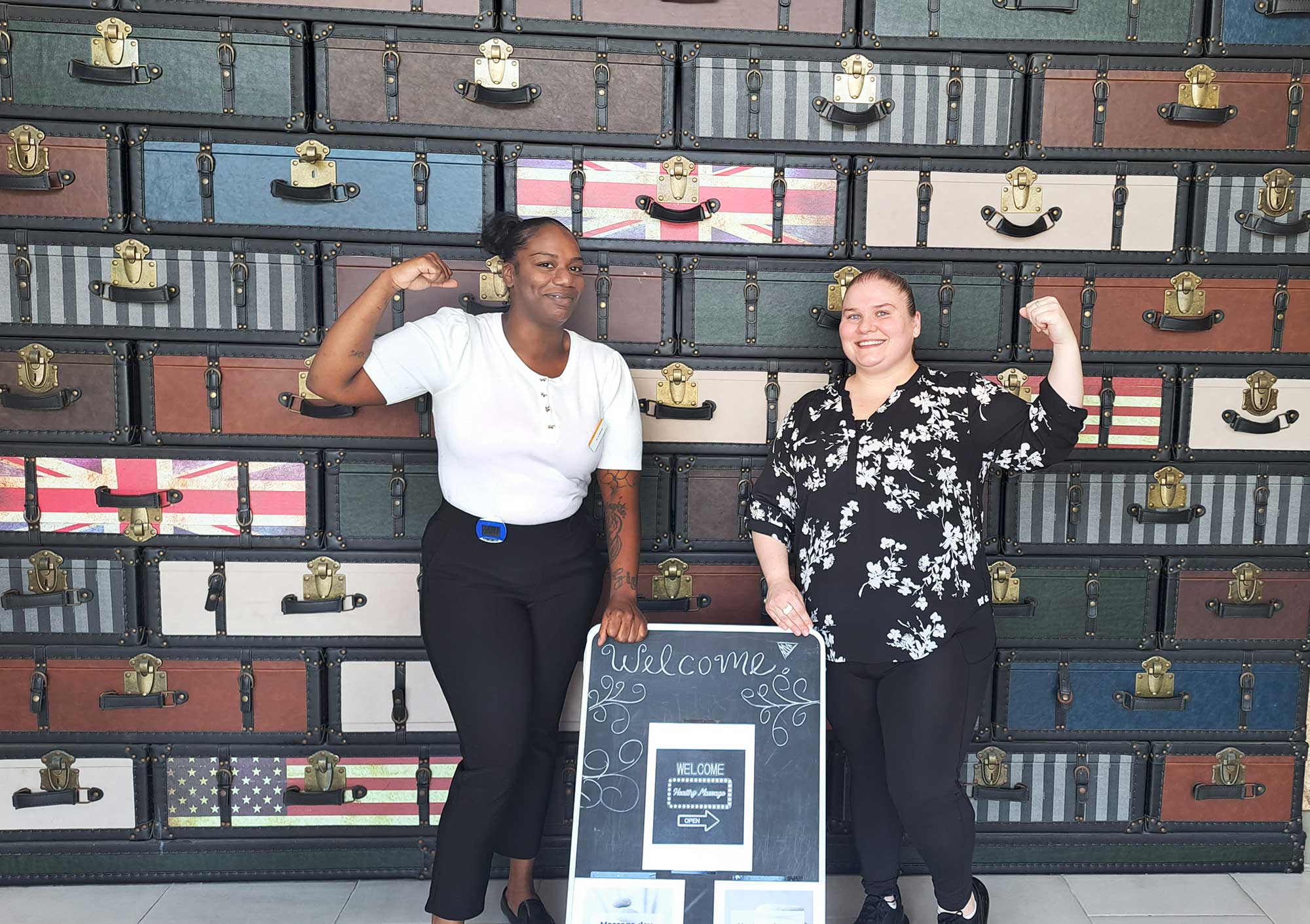 From front desk to full flex, Guest Service Agents Anita Samuels, left, and Meaghan Mathews power through ‘Wellness Week’ at the Comfort Inn JFK Airport.