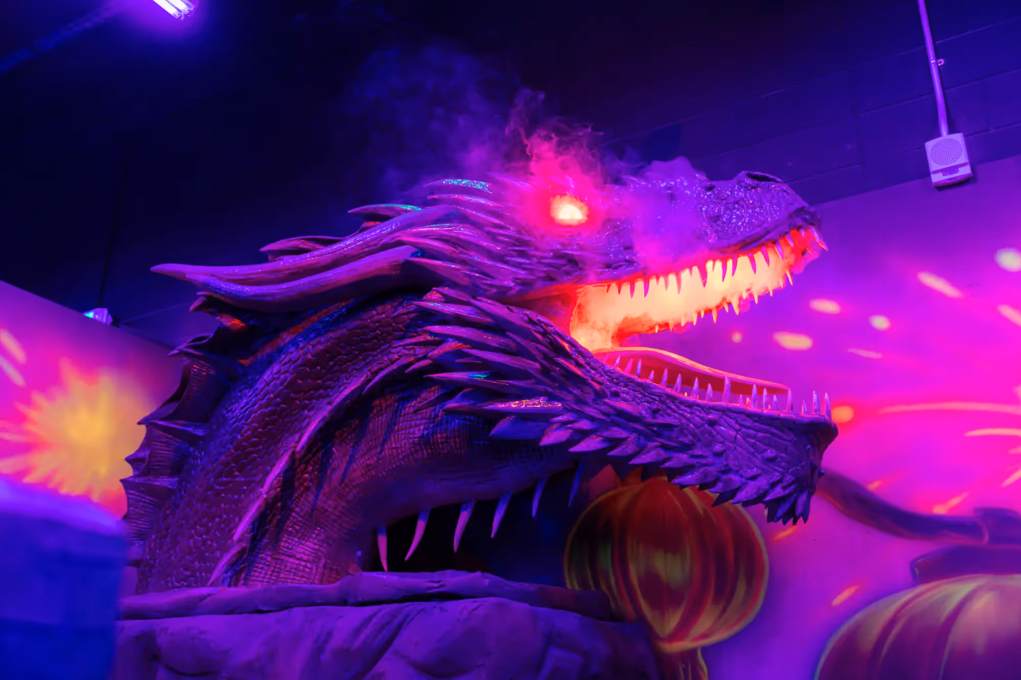 A purple dragon with a mouth full of teeth.
