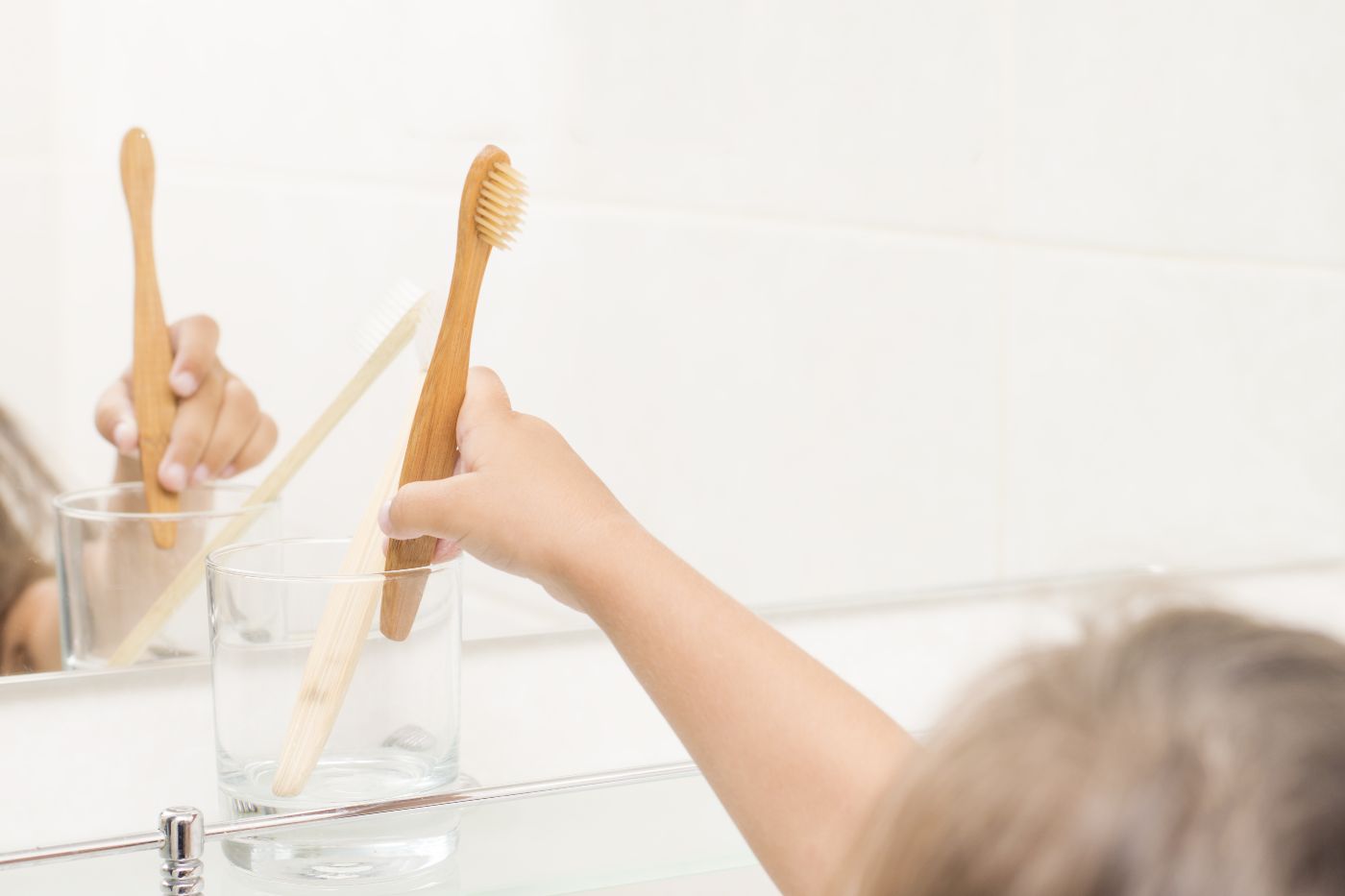 Child brushing their teeth at home in Houston, TX