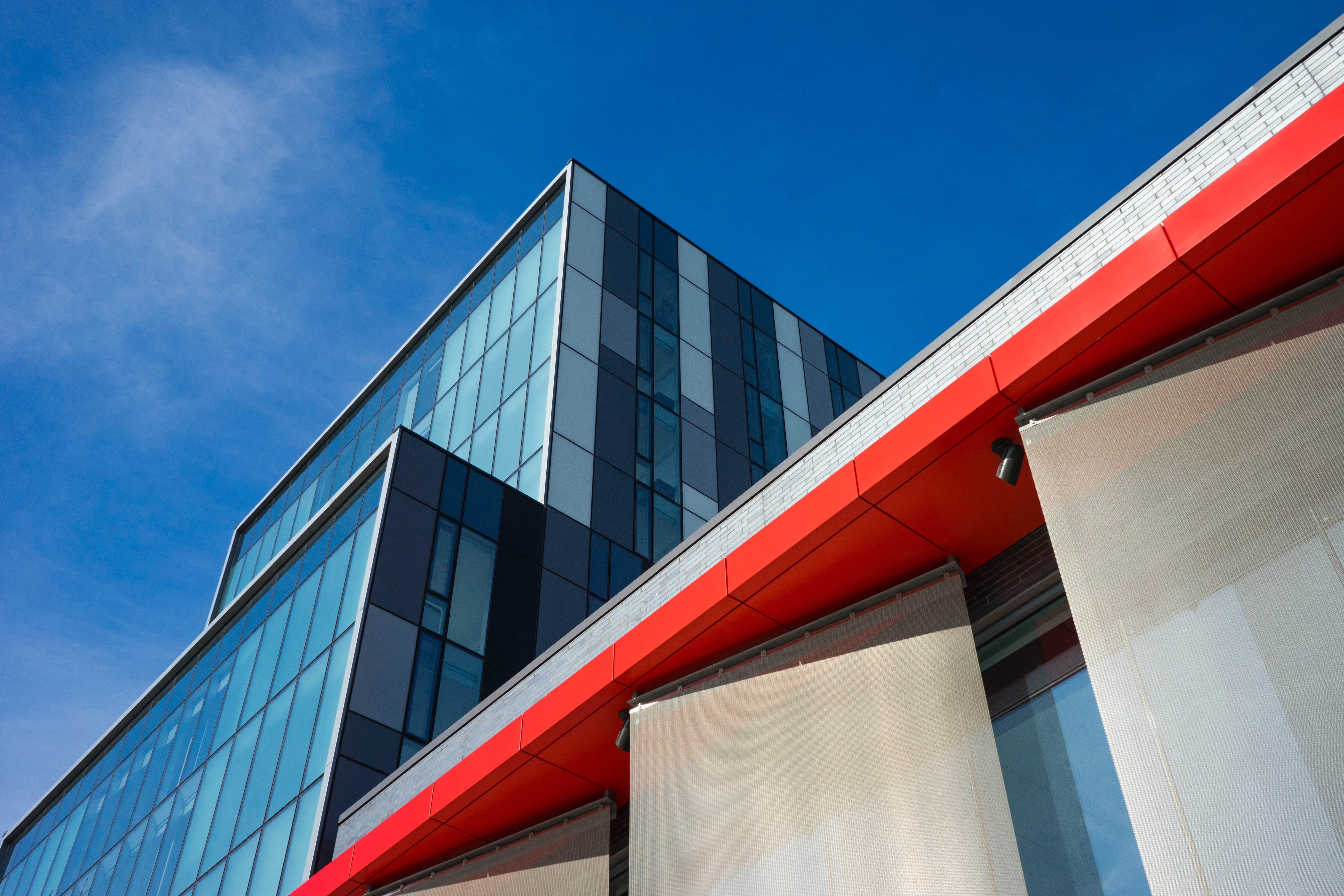 Beautiful photography of an office building with glassed walls. Photo by Erik Babinski.