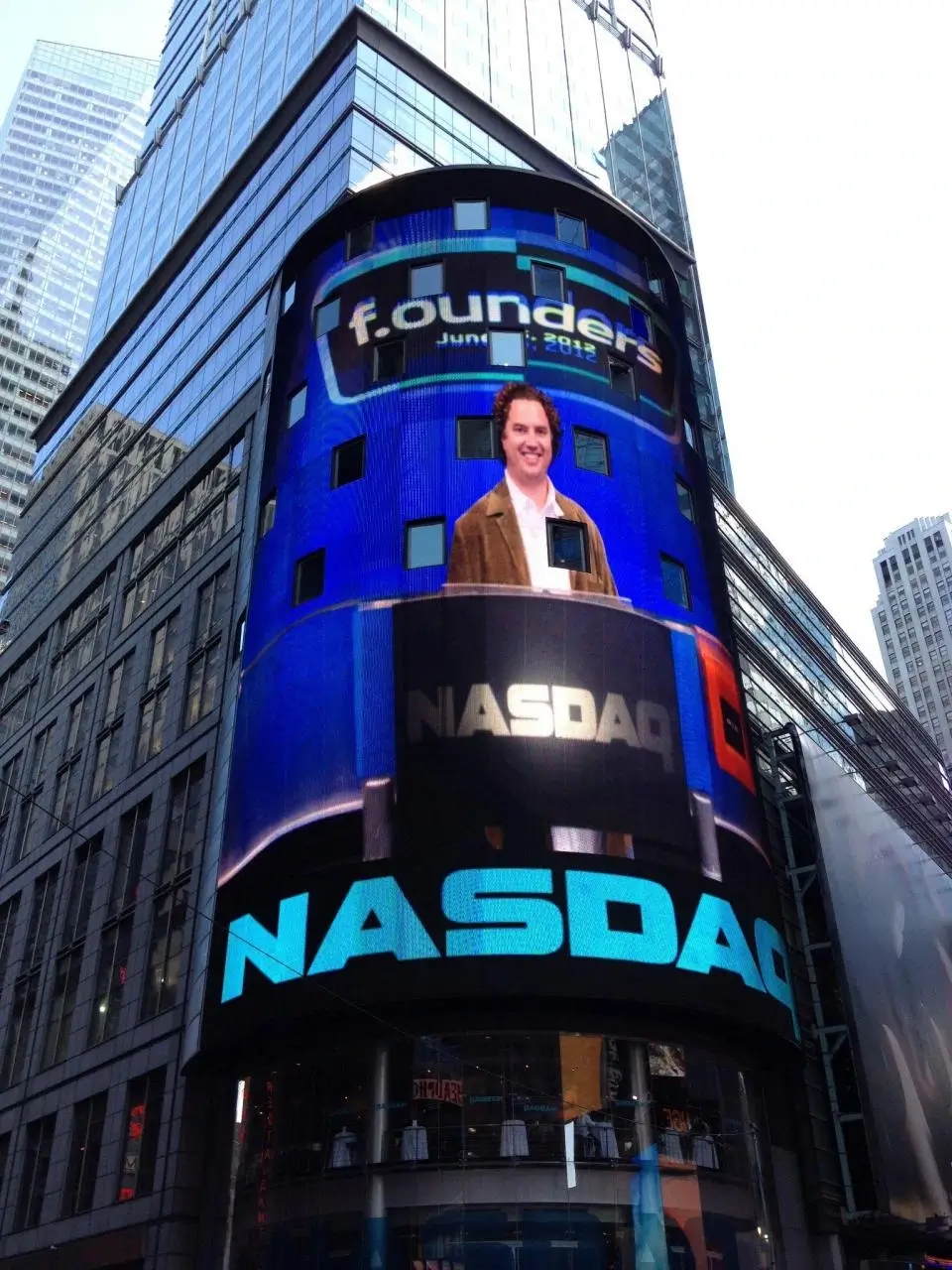 Building with NASDAQ shown on the screen