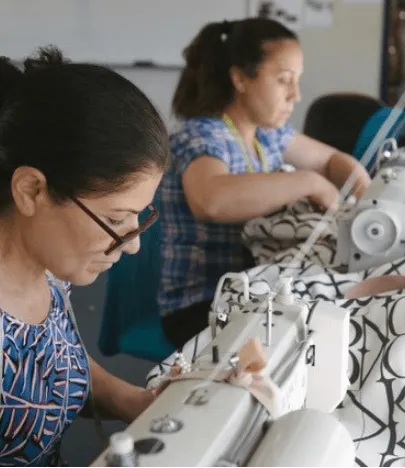 Two women working on textiles