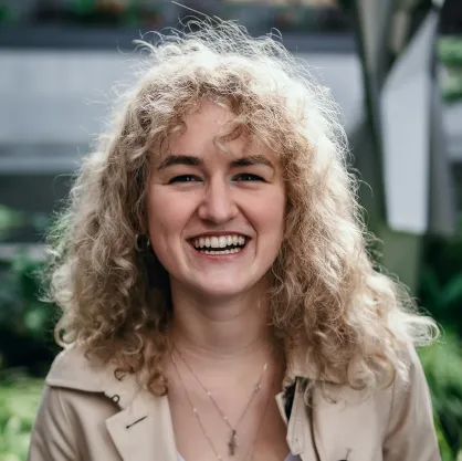A young woman smiling in nature