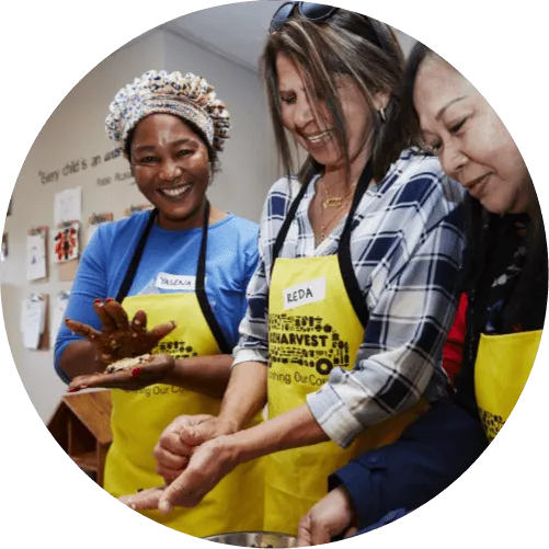 A group of people making meals for those in need