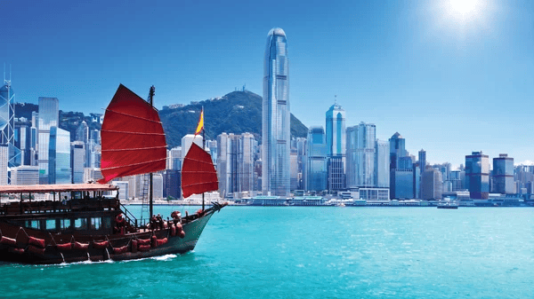 A view of the Hong Kong skyline featuring a "junk" in the foreground
