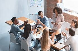 a group of diverse professionals collaboratively engaged in a modern office meeting