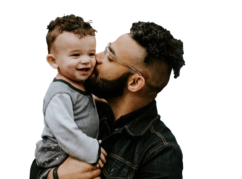 Dad kissing baby