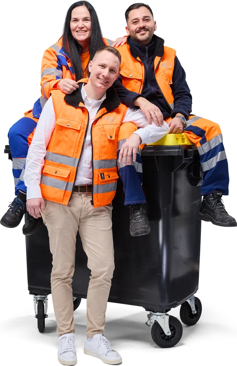 Team von FES an einem Müllbehälter