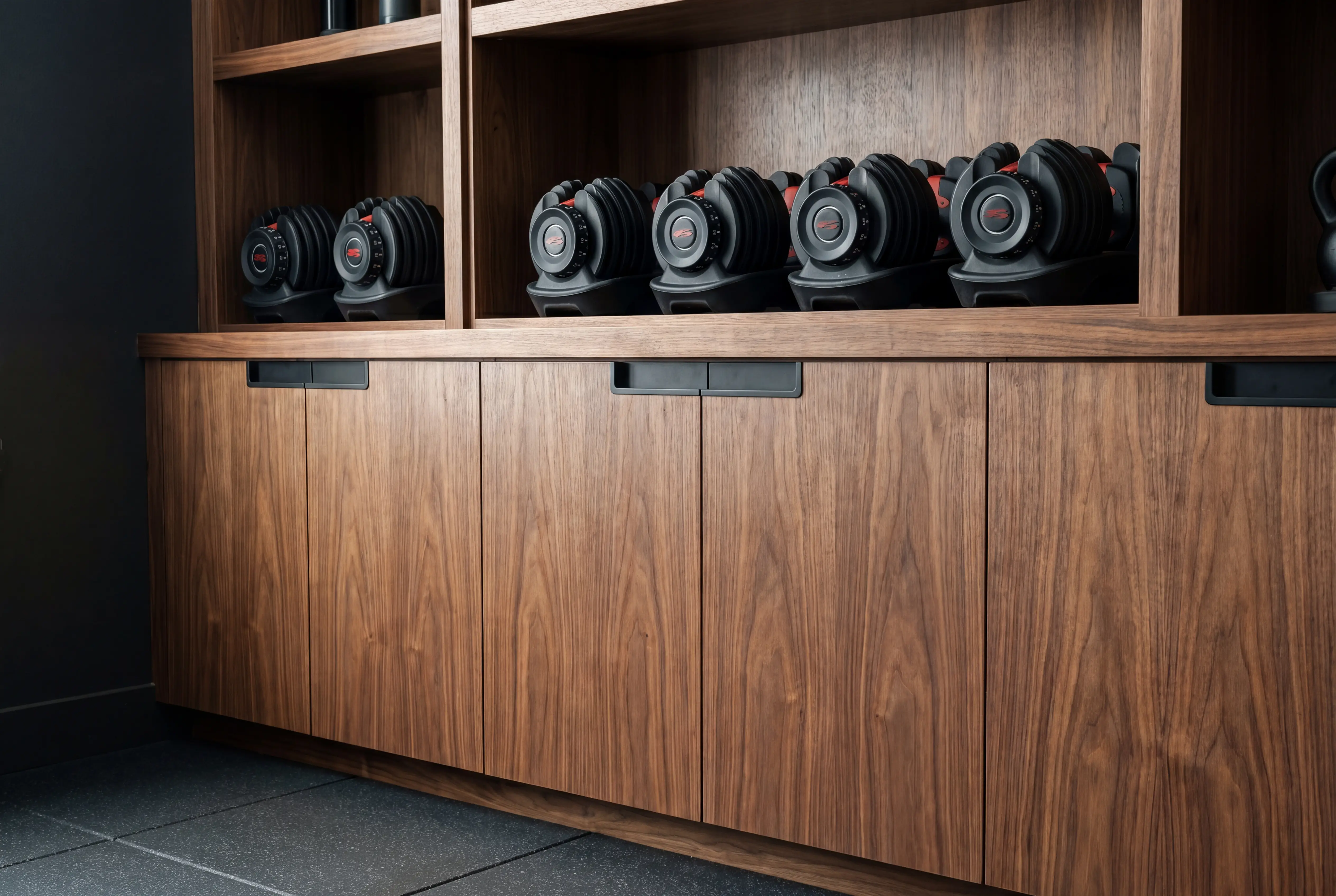 custom gym storage millwork walnut built-in manhattan apartment
