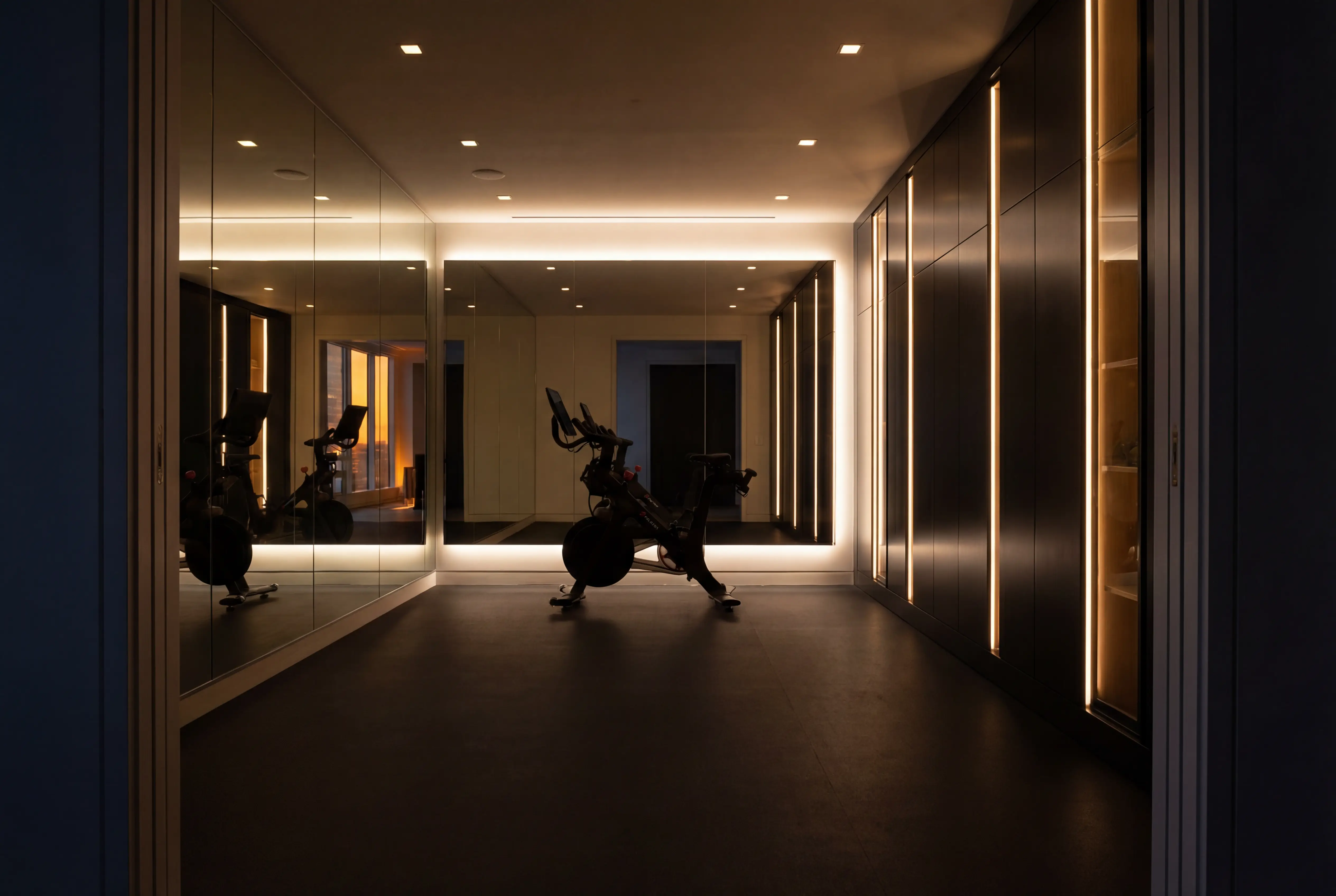 luxury home gym manhattan apartment night lighting custom millwork