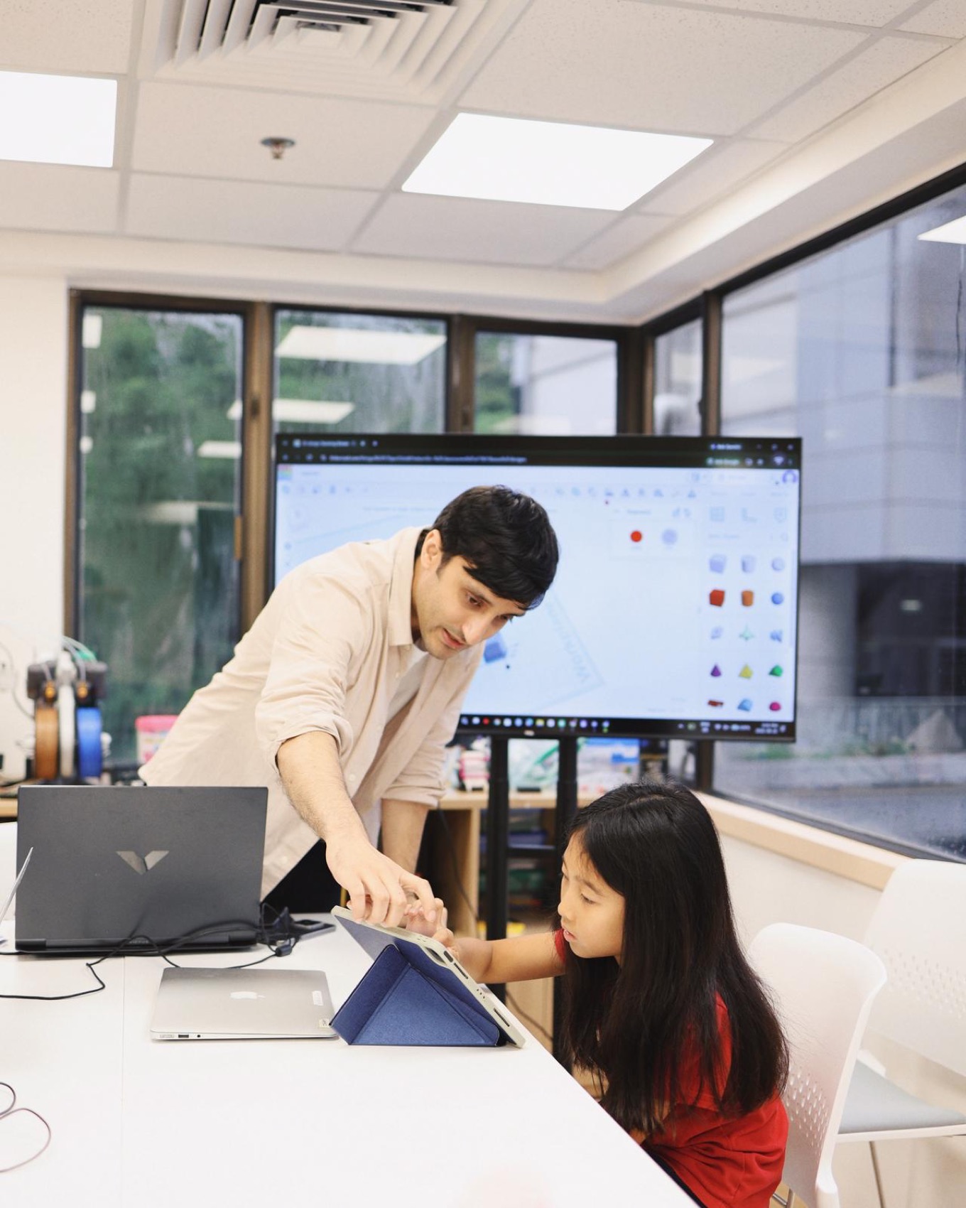 A teacher supporting students as they develop ideas
