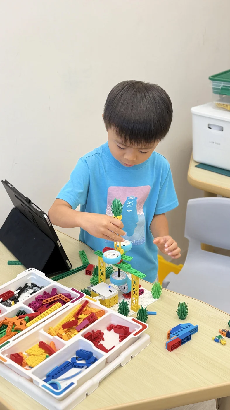 A student building a LEGO model