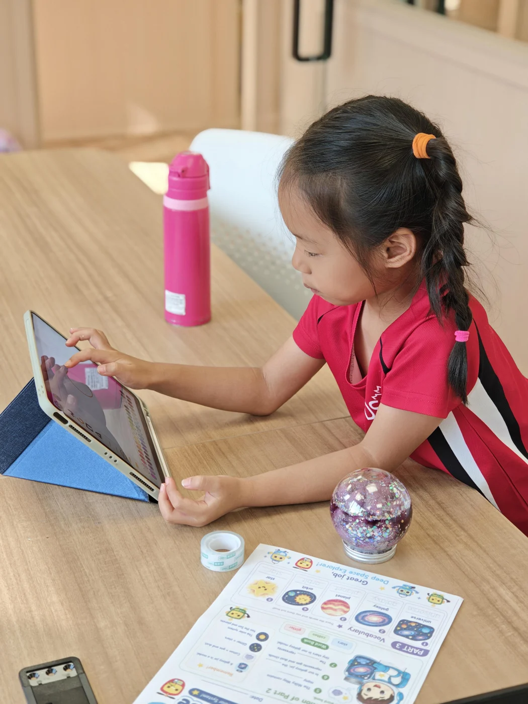 A student working on a tablet in the SUP classroom
