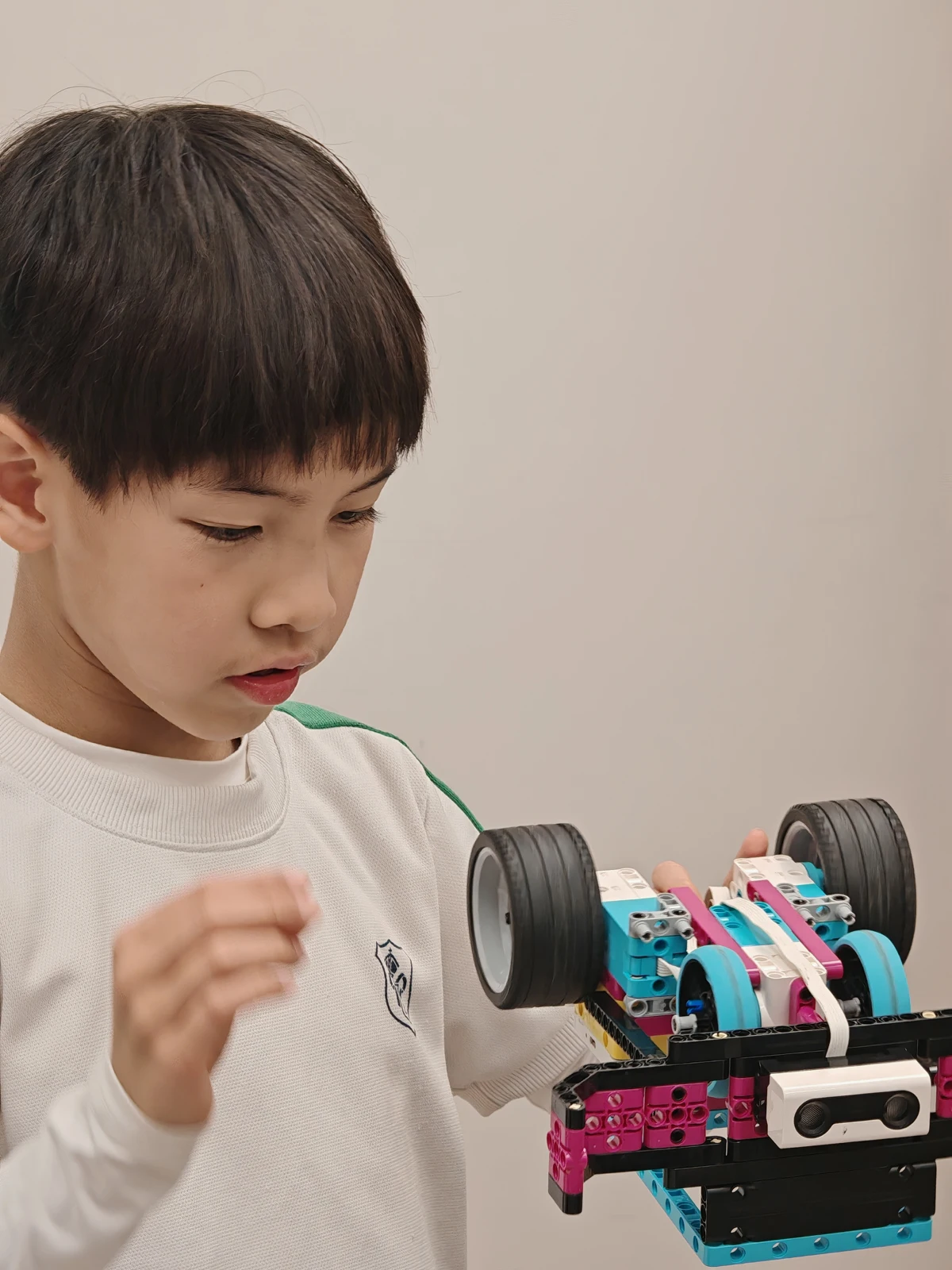 A student programming a LEGO robot