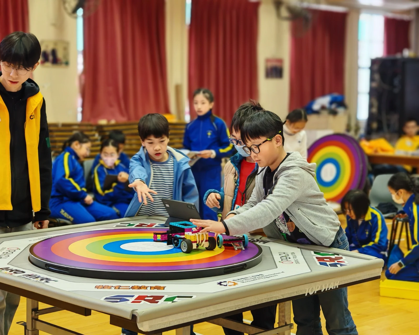 Students testing their robot on a competition field