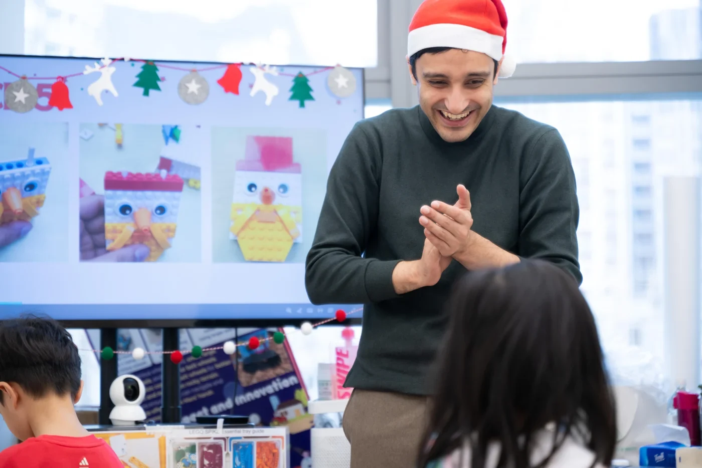 A SUP teacher engaging children in a classroom activity