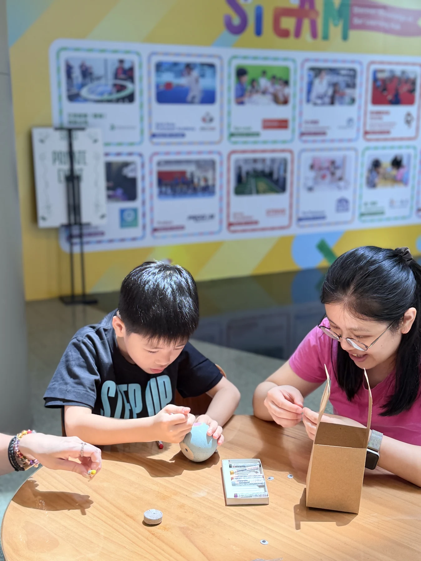 Parents and children exploring food and growing at SEED by Farmacy, Cyberport