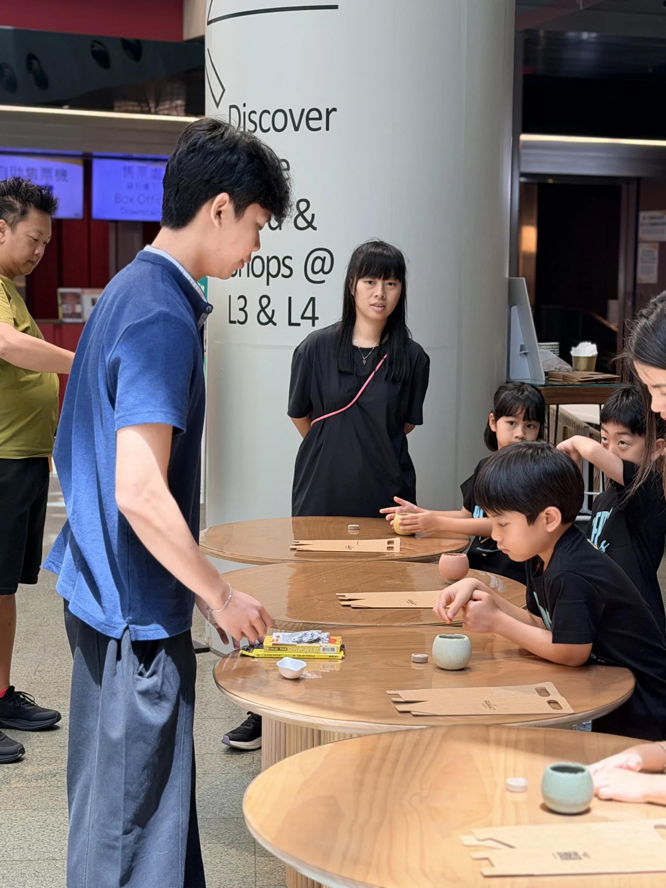Parents and children exploring food and growing at SEED by Farmacy, Cyberport