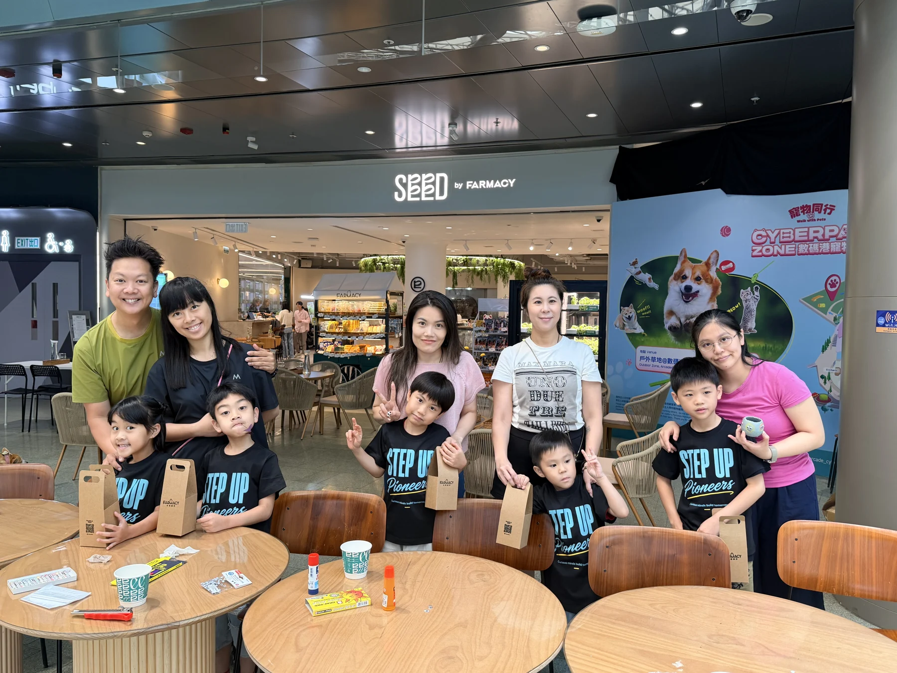 Parents and children exploring food and growing at SEED by Farmacy, Cyberport