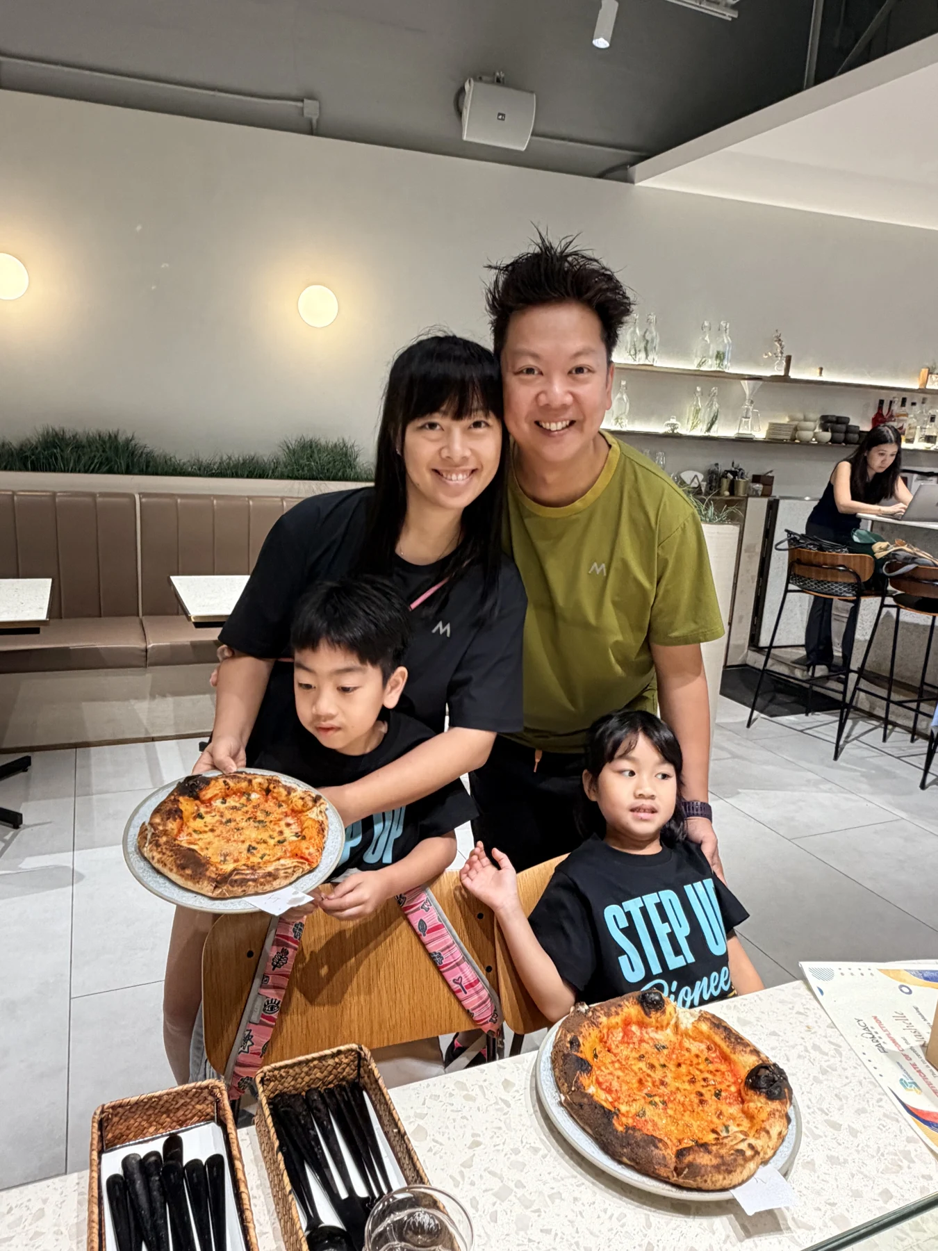 Families preparing or sharing their pizzas at SEED by Farmacy