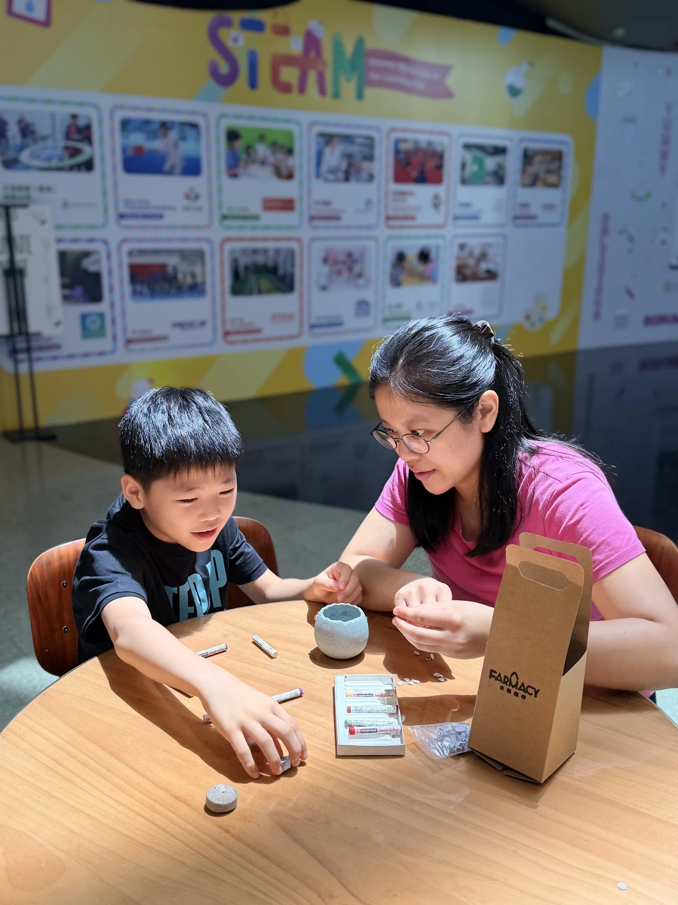 Parents and children exploring food and growing at SEED by Farmacy, Cyberport