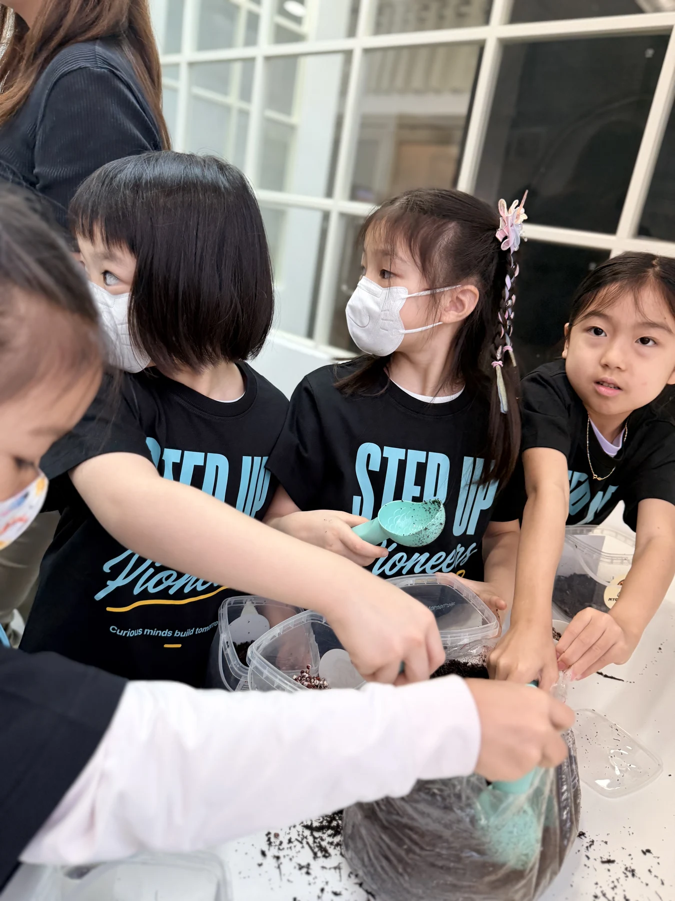 Students exploring mushroom growing and preparing take-home kits at Myconoko Lab