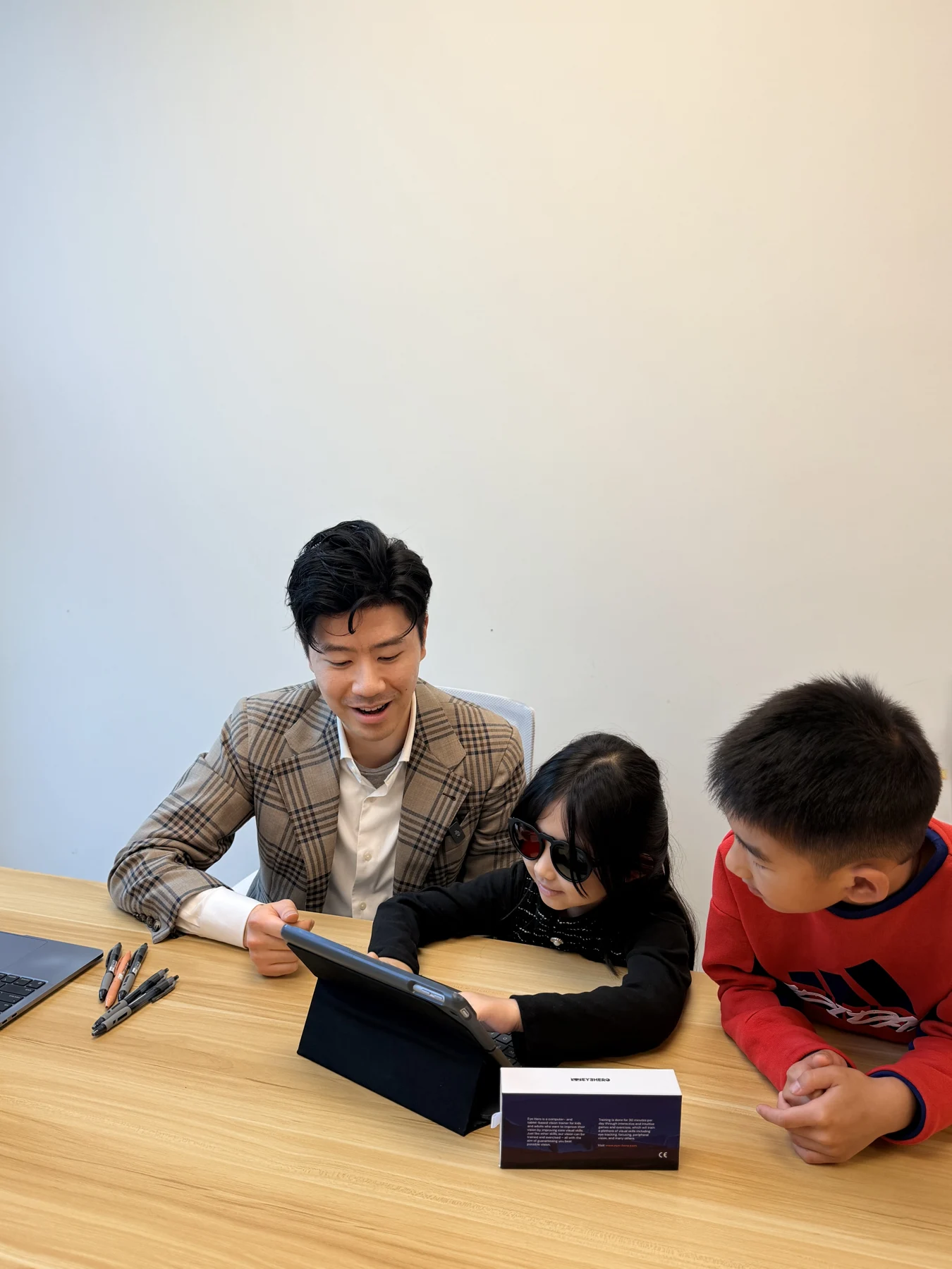 Children exploring an activity together with Jeff