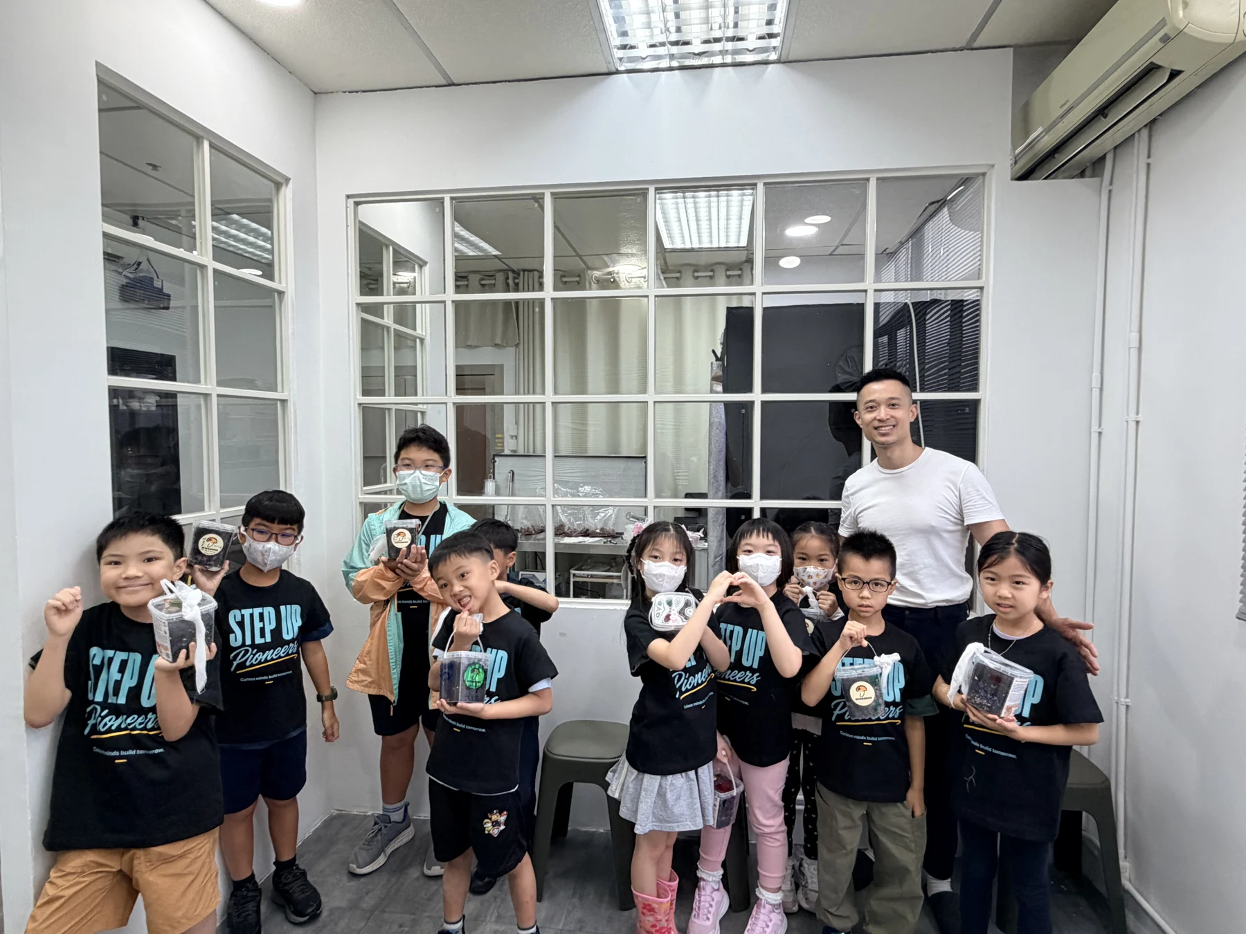 Students exploring mushroom growing and preparing take-home kits at Myconoko Lab