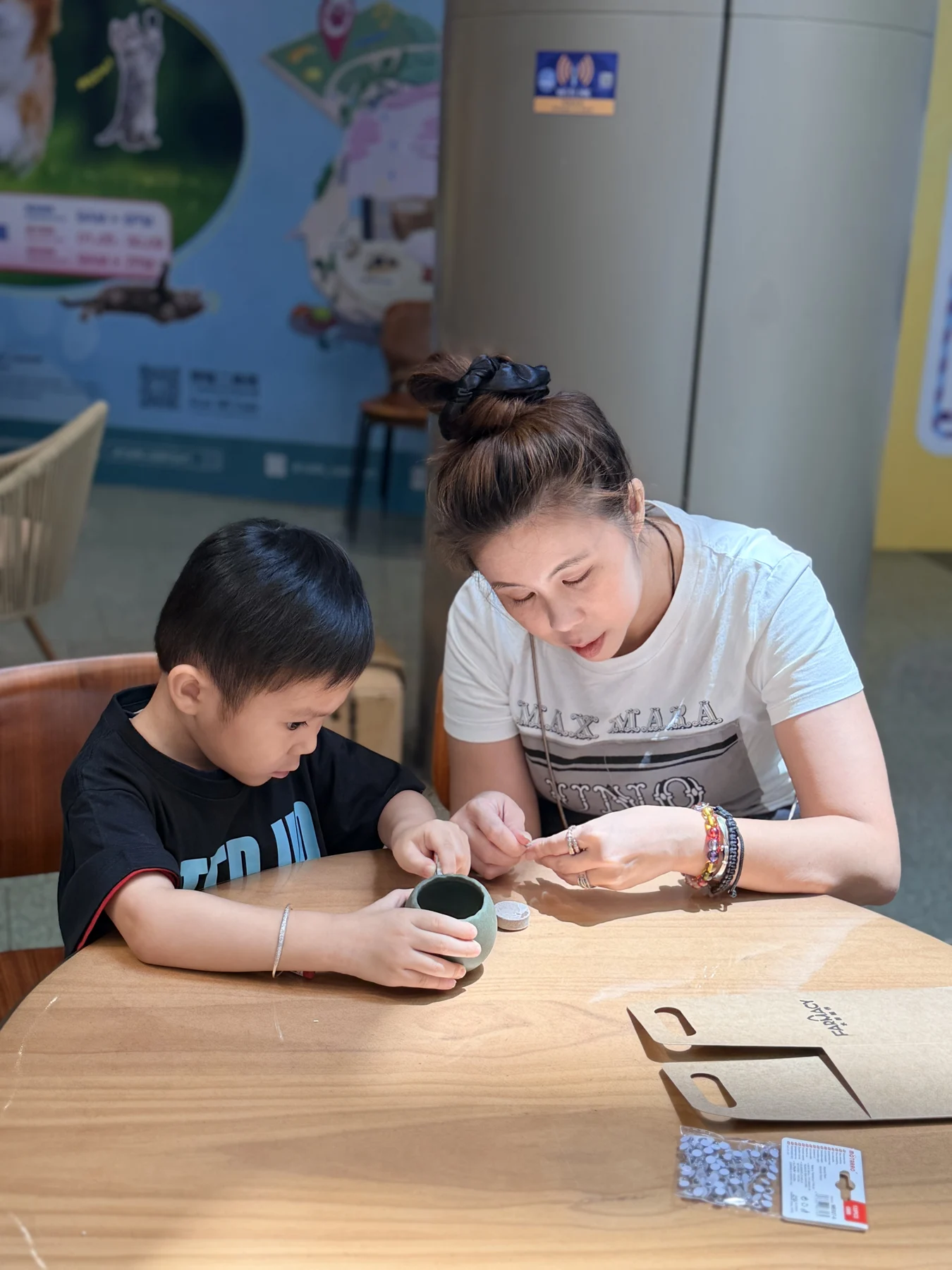 Parents and children exploring food and growing at SEED by Farmacy, Cyberport