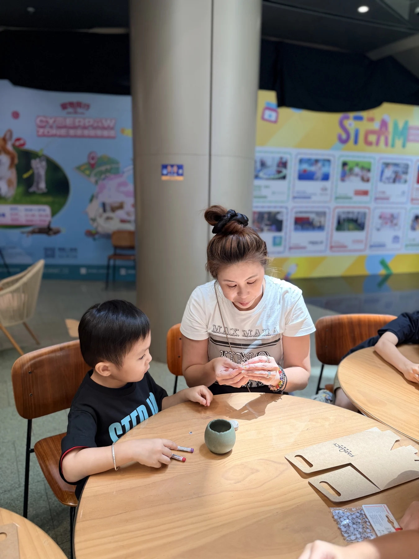 Parents and children exploring food and growing at SEED by Farmacy, Cyberport
