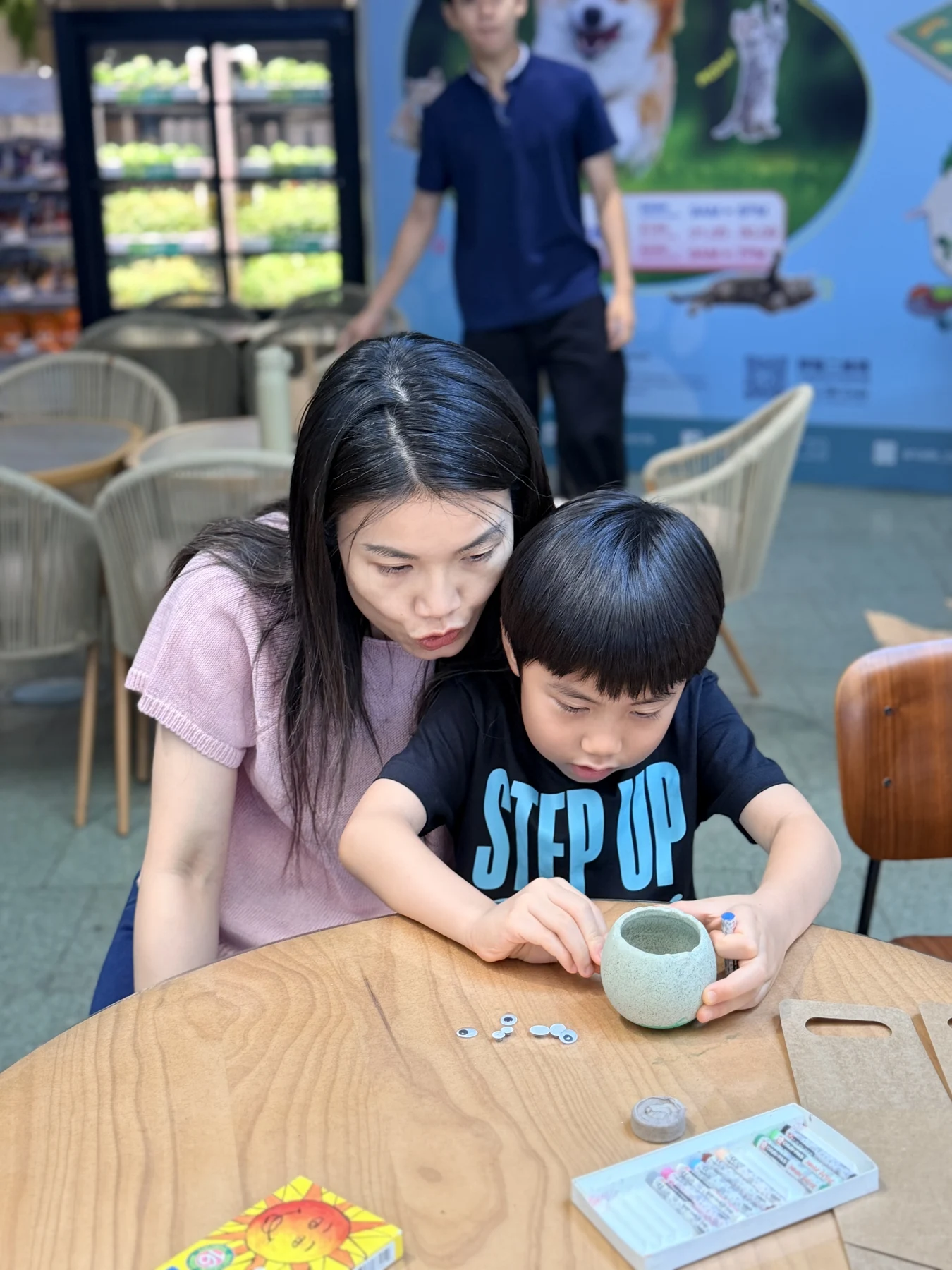 Parents and children exploring food and growing at SEED by Farmacy, Cyberport