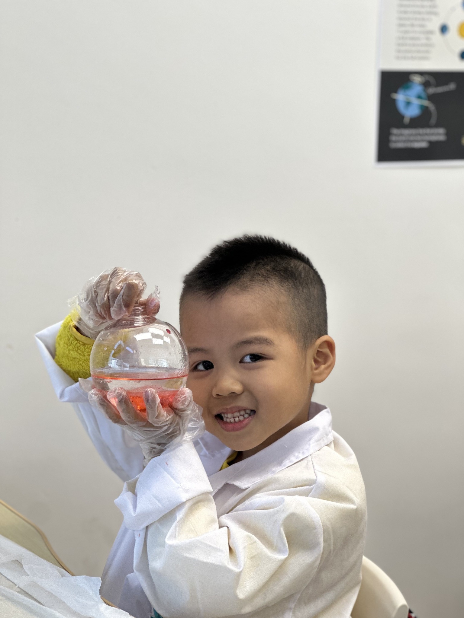 A student proudly showing a snow globe