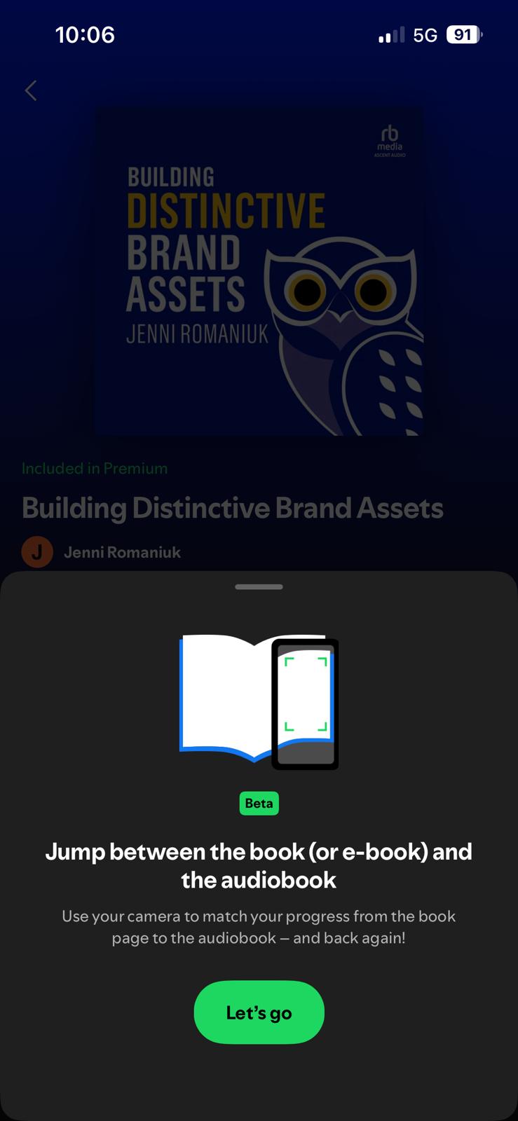 Mobile screen shows 'Building Distinctive Brand Assets' cover with a beta prompt about jumping between book and audiobook.