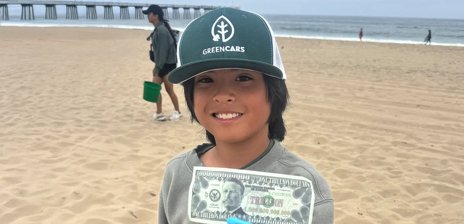 child holding dollar