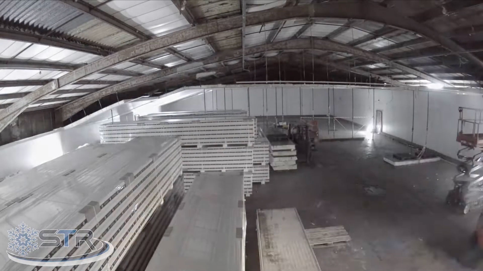 Inside a large warehouse with materials inside