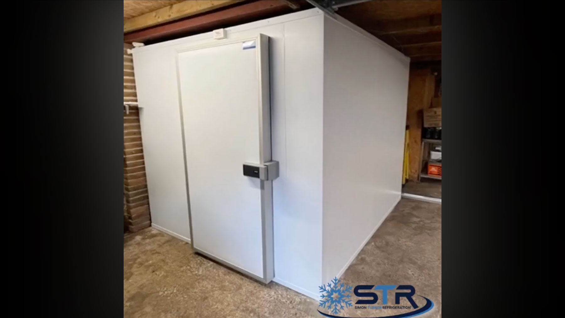 A small white walk in freezer room