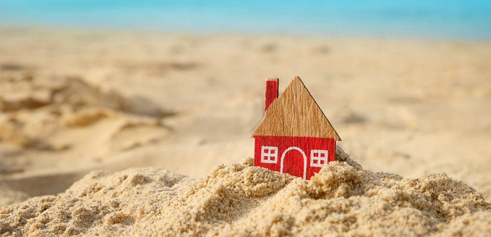 little red house on sand beach, holiday natural background.