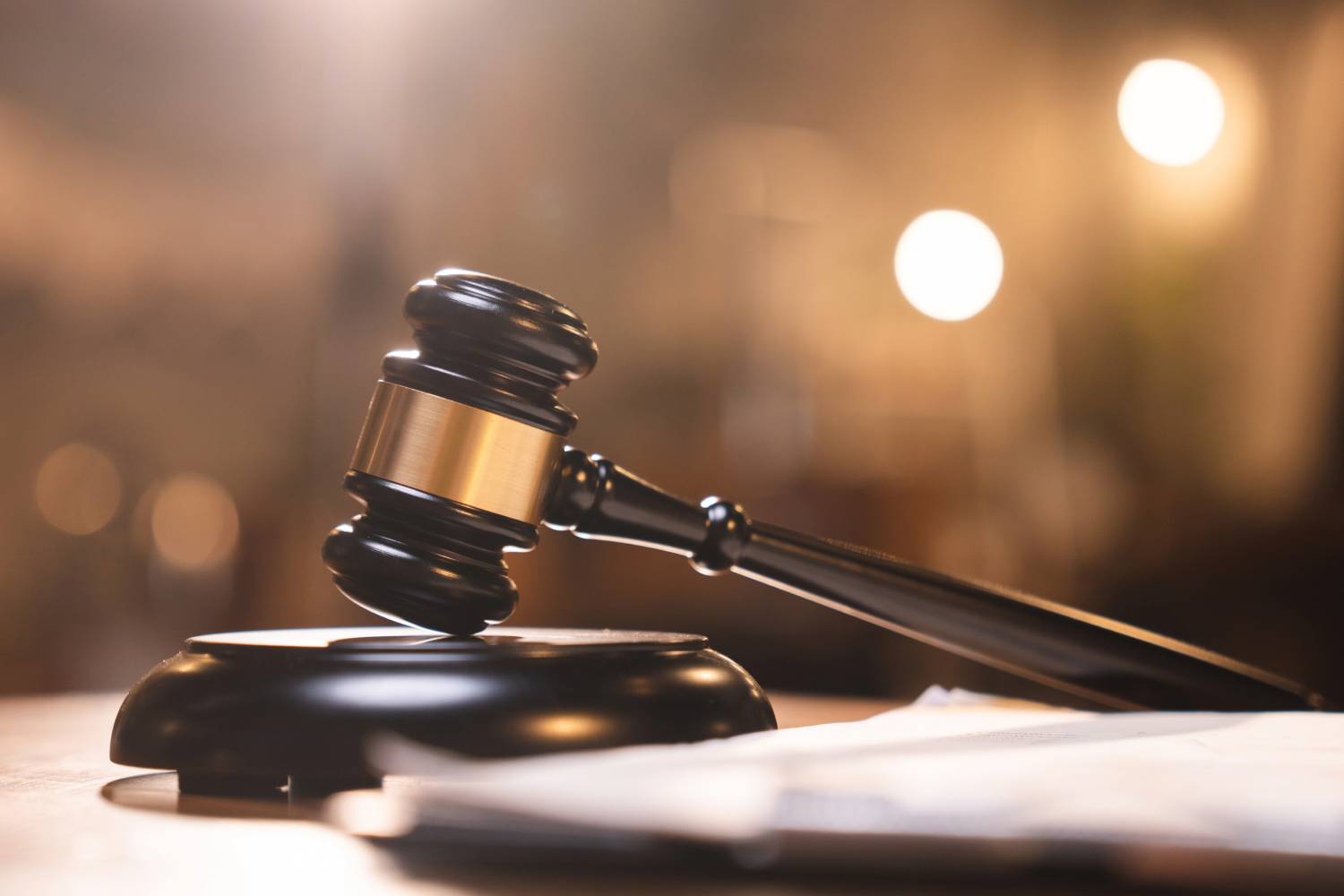 Gavel on a desk symbolizing legal support in commercial debt collection.