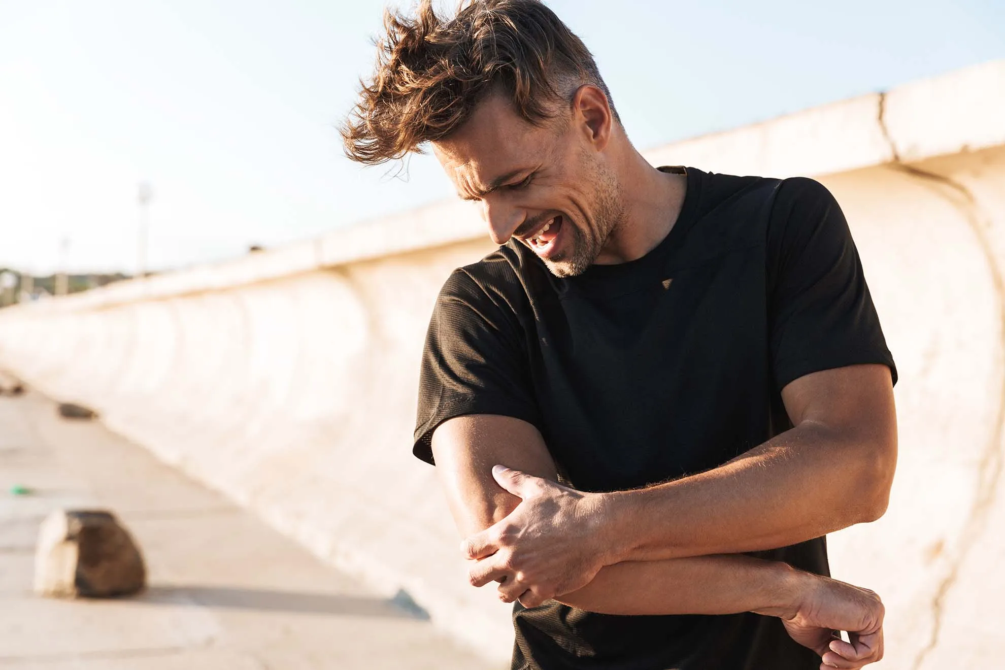 Man experiencing elbow pain