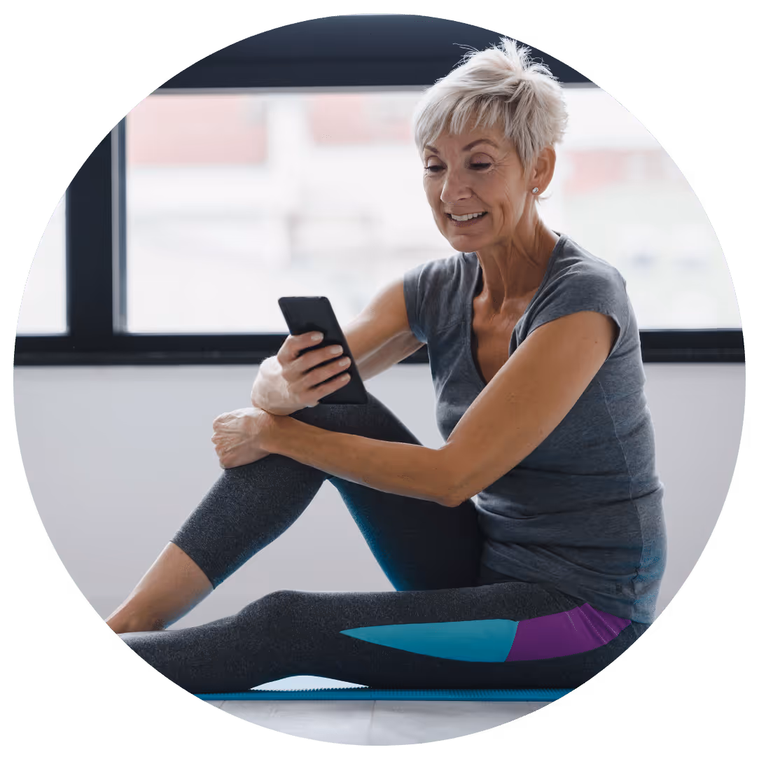 Woman holding water bottle after exercising