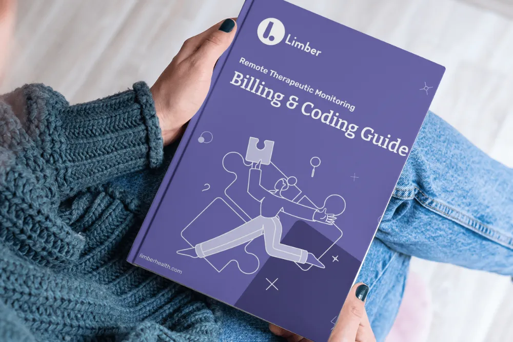 person holding Limber Health RTM Billing and coding guide