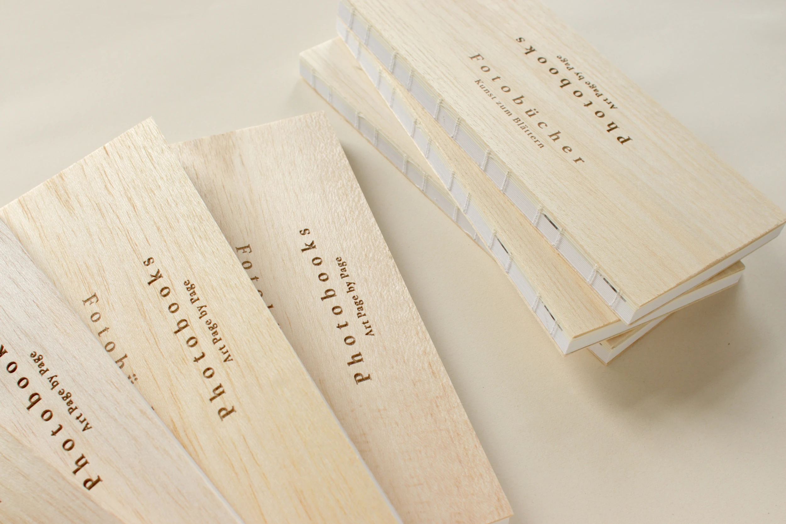 Emerging from an exhibition of the same name, Photobooks. Art Page by Page, which considers ‘the photobook as an art object and a storytelling medium’ (Kruse, 2021) features a laser engraved wooden cover and naked binding.